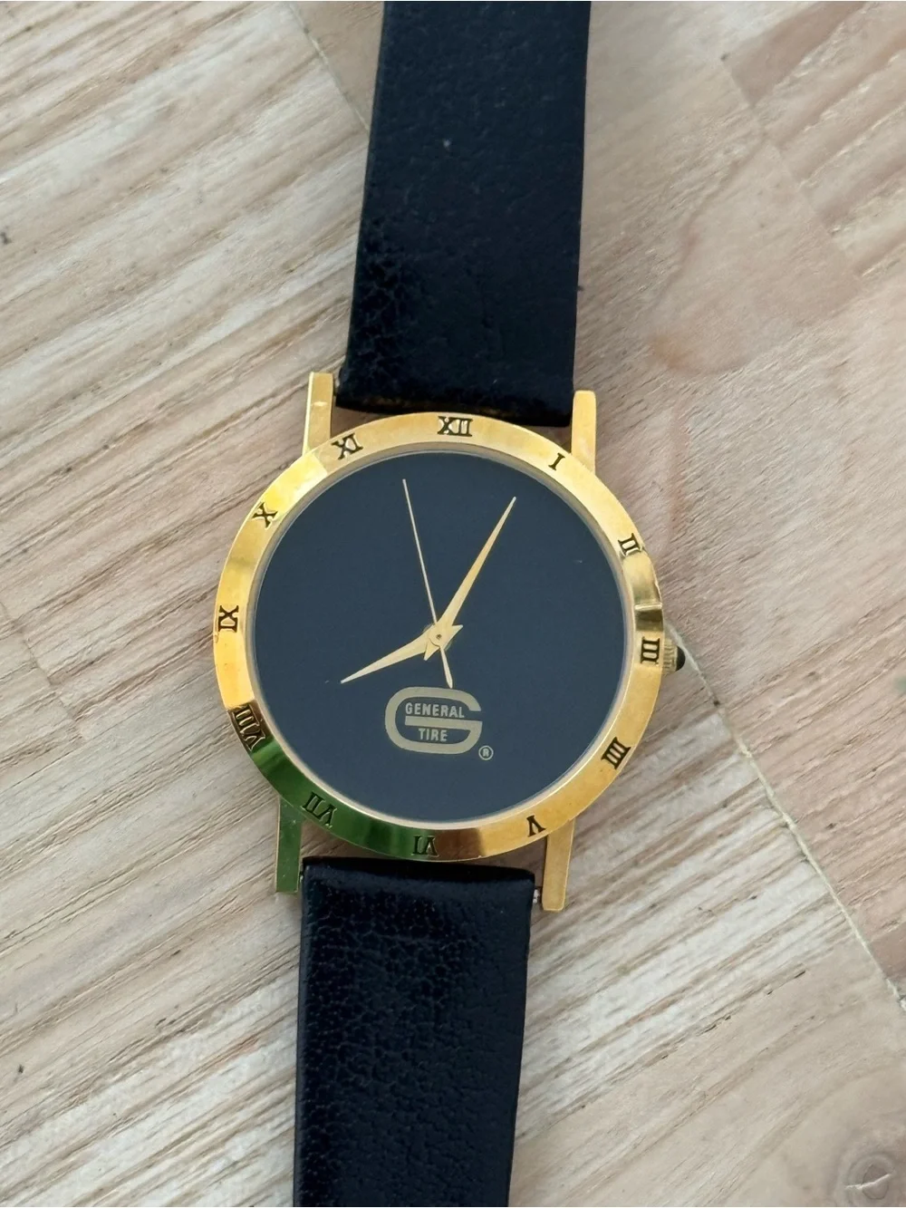 General Tire Dress Watch Black Dial Leather Strap Gold-Tone Case Hands